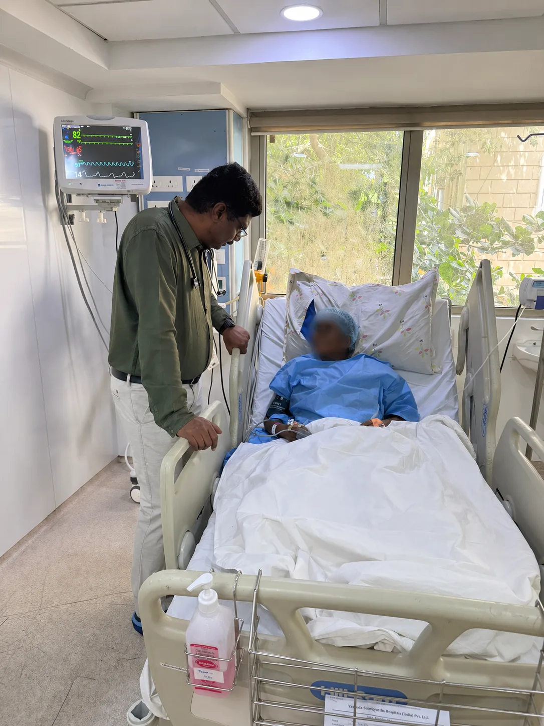 Dr. J. Saravanan with post-operative patient — ward care